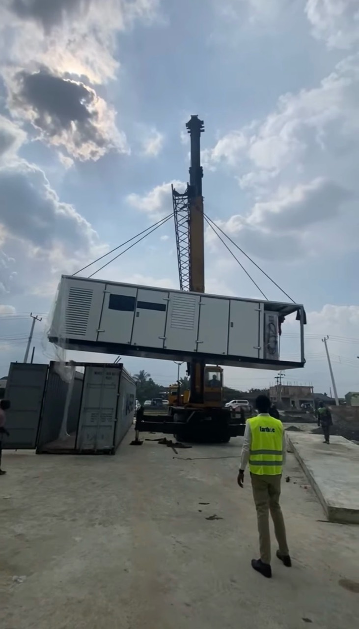 Packaged CNG equipment being positioned by crane